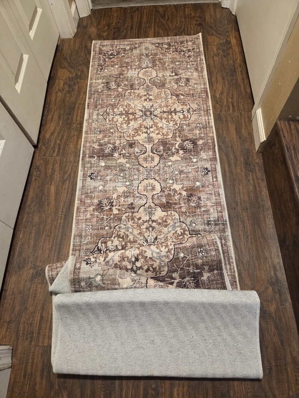 Brown and mauve Persian medallion runner rug with a distressed vintage finish an